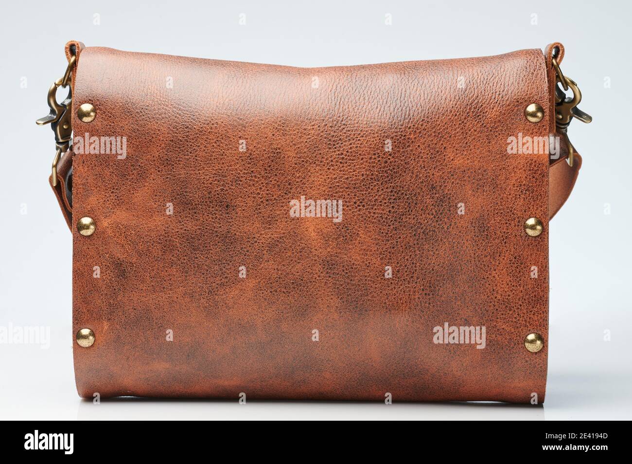 Modern brown leather bag back view isolated on white studio background Stock Photo
