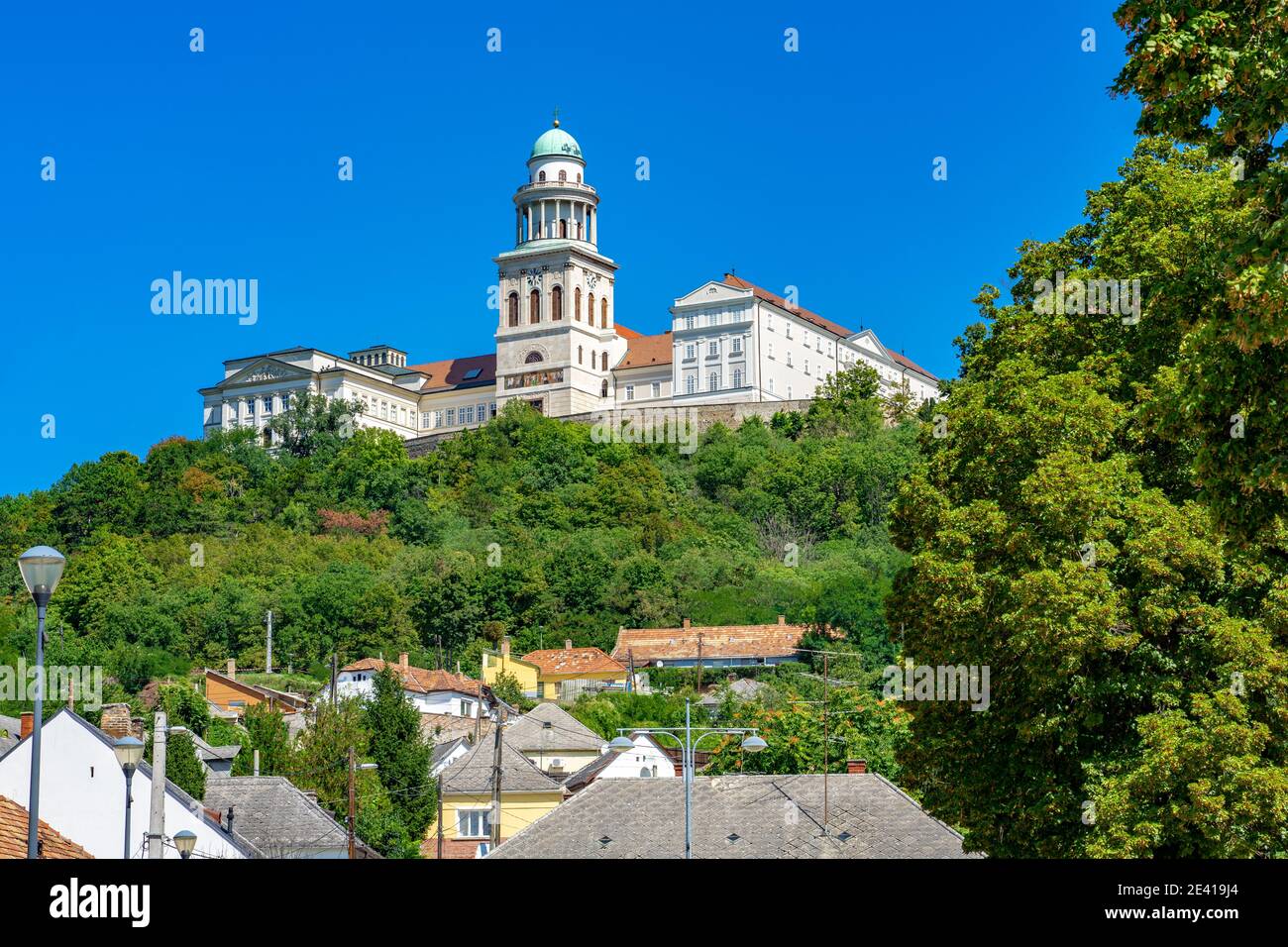 Pannonhalma arch abbey on the hill with old houses around it in Hungary Stock Photo