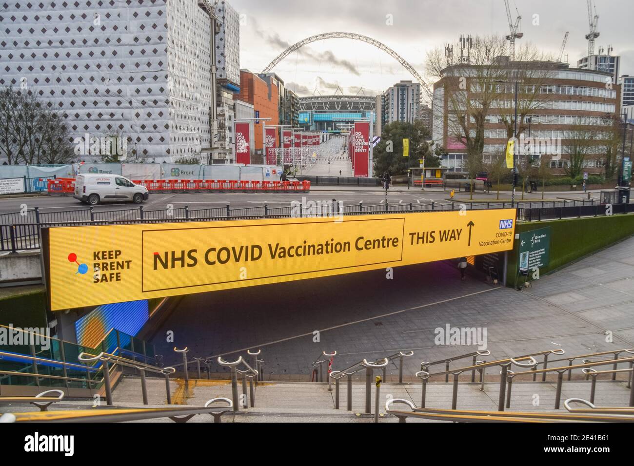 London, UK. 21st Jan, 2021. A large sign for the NHS covid-19 Vaccination Centre outside Wembley Park station in London.Several mass vaccination sites have been opened around England, as the government rolls out its coronavirus vaccination program. Credit: SOPA Images Limited/Alamy Live News Stock Photo