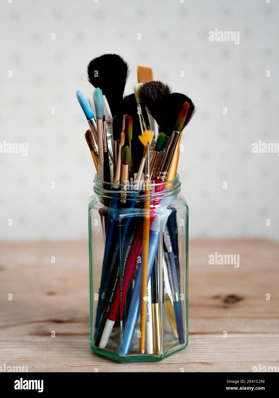 Artists water colour paint brushes in a glass jar Stock Photo Alamy