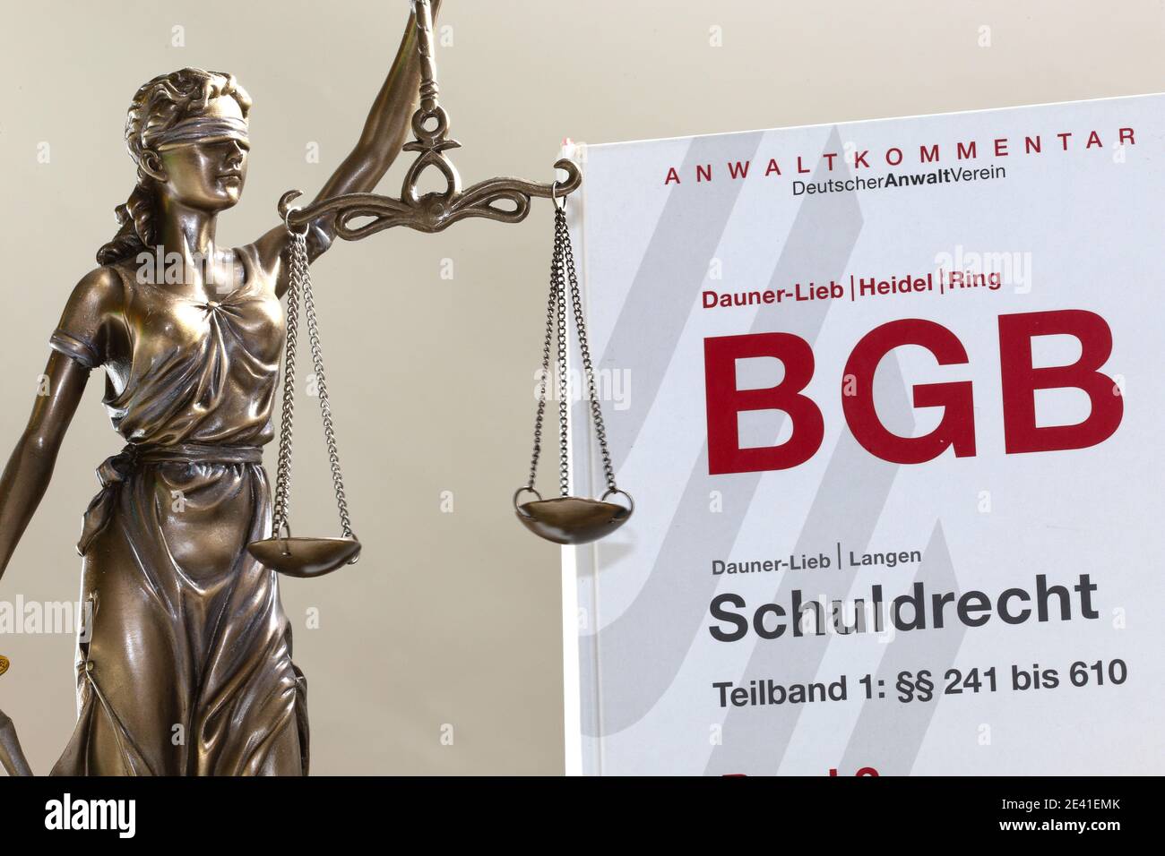 Symbol image: Law of obligation (Schuldrecht) and a Justitia (editorial) Stock Photo