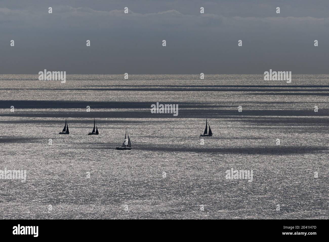 Silhouetted sailing boats in Pool bay Stock Photo - Alamy