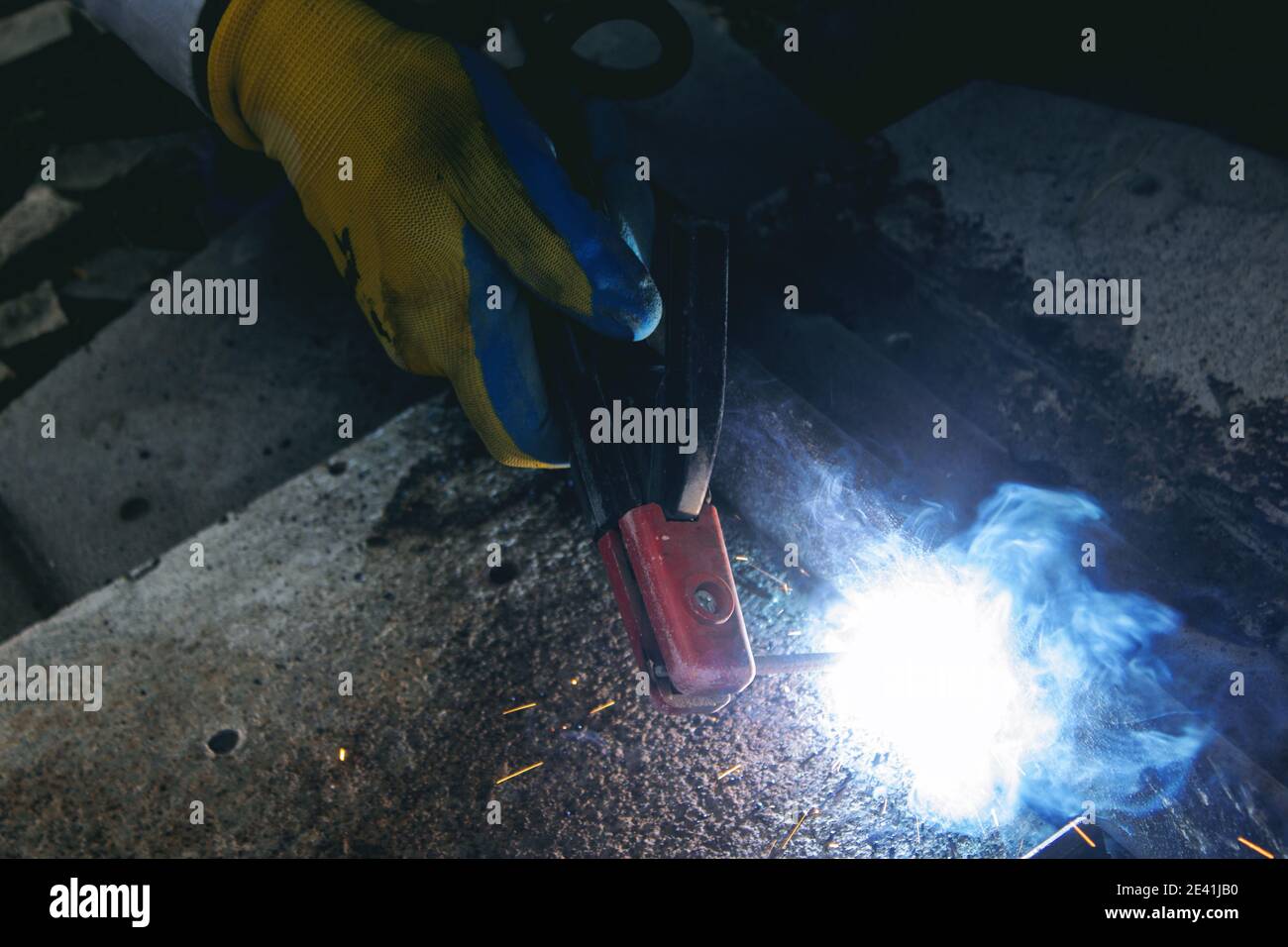 young foreman doing electrical welding Stock Photo Alamy