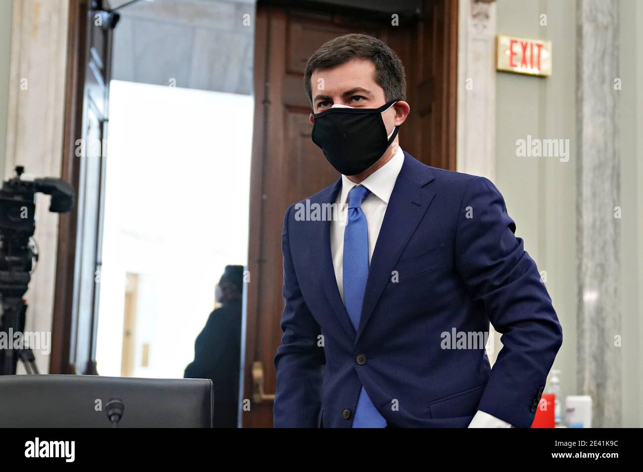 Pete Buttigieg, U.S. secretary of transportation nominee for U.S. President Joe Biden, wears a protective mask while arriving to a Senate Commerce, Science and Transportation Committee confirmation hearing in Washington, DC, U.S., on Thursday, Jan. 21, 2021. Buttigieg, is pledging to carry out the administration's ambitious agenda to rebuild the nation's infrastructure, calling it a 'generational opportunity' to create new jobs, fight economic inequality and stem climate change. Credit: Stefani Reynolds/Pool via CNP | usage worldwide Stock Photo
