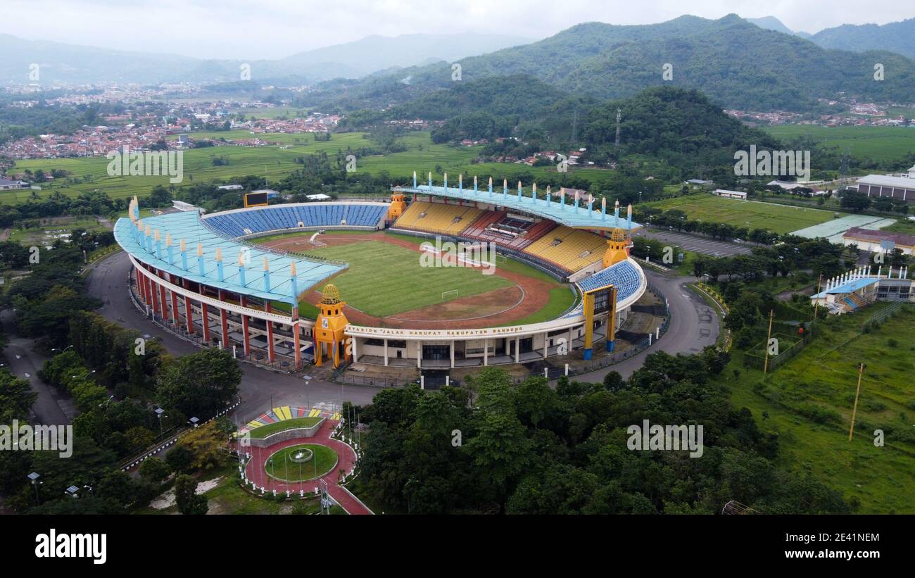 Aerial view of football stadium in Bandung City, Indonesia. Sunset/sunrise and noise cloud