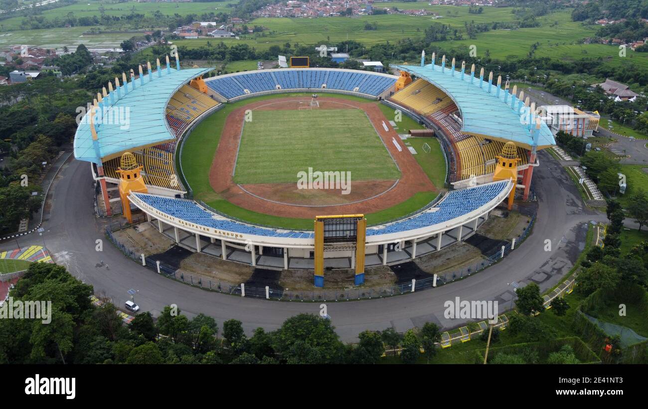 Aerial view of football stadium in Bandung City, Indonesia. Sunset