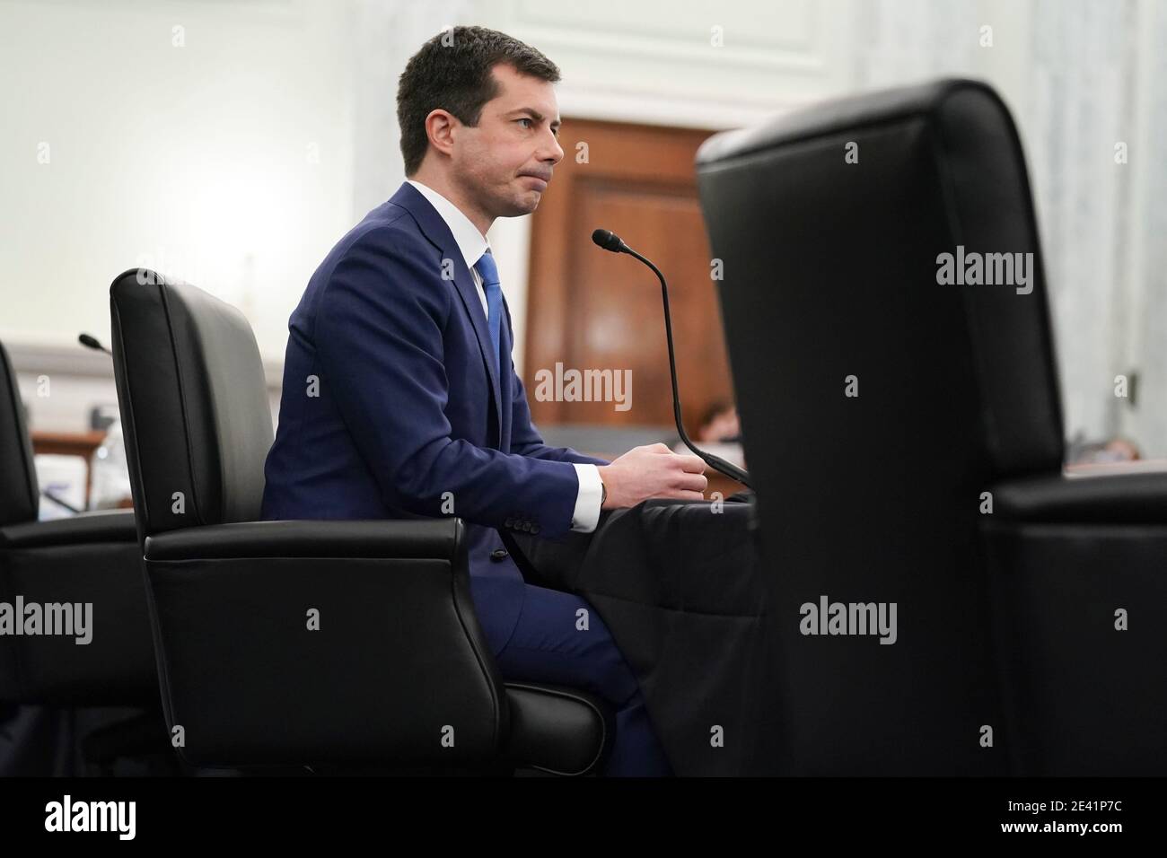 Washington, DC, USA. 21st Jan, 2021. Pete Buttigieg, U.S. secretary of transportation nominee for U.S. President Joe Biden, listens during a Senate Commerce, Science and Transportation Committee confirmation hearing in Washington, DC, U.S., on Thursday, Jan. 21, 2021. Buttigieg, is pledging to carry out the administration's ambitious agenda to rebuild the nation's infrastructure, calling it a 'generational opportunity' to create new jobs, fight economic inequality and stem climate change. Credit: Stefani Reynolds/Pool via CNP | usage worldwide Credit: dpa/Alamy Live News Stock Photo