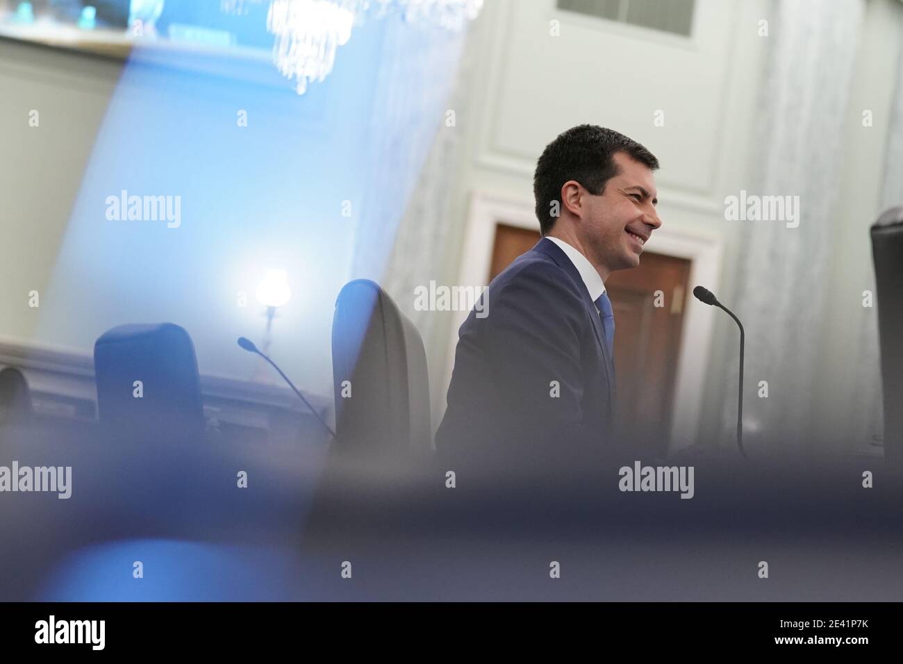 Washington, DC, USA. 21st Jan, 2021. Pete Buttigieg, U.S. secretary of transportation nominee for U.S. President Joe Biden, smiles during a Senate Commerce, Science and Transportation Committee confirmation hearing in Washington, DC, U.S., on Thursday, Jan. 21, 2021. Buttigieg, is pledging to carry out the administration's ambitious agenda to rebuild the nation's infrastructure, calling it a 'generational opportunity' to create new jobs, fight economic inequality and stem climate change. Credit: Stefani Reynolds/Pool via CNP | usage worldwide Credit: dpa/Alamy Live News Stock Photo