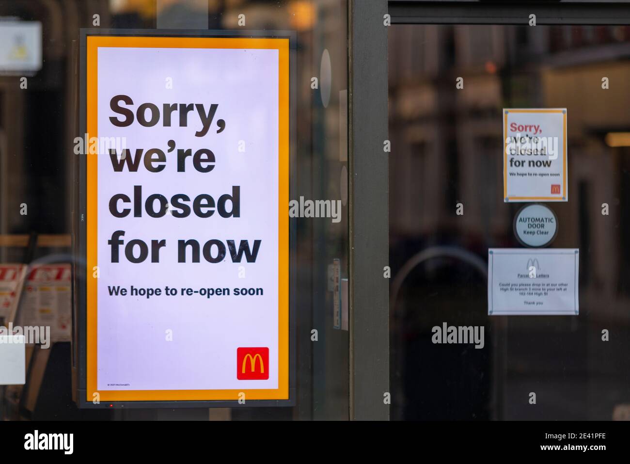 Closed McDonalds restaurant in High Street, Southend on Sea, Essex, UK. Sign on door window. Sorry, we're closed for now Stock Photo