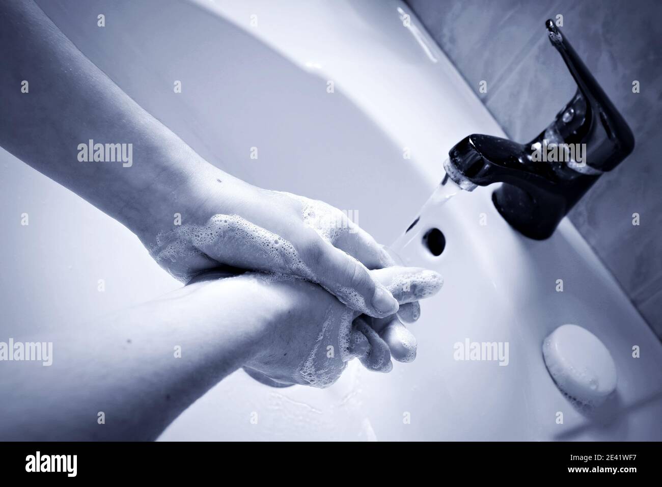 Sanitary disinfection protocol. Woman washing her hands with antiseptic