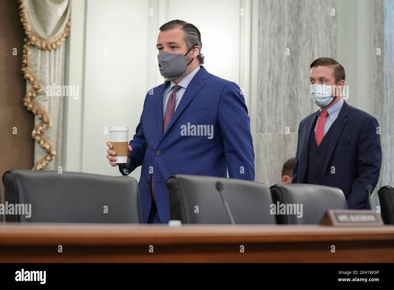 United States Senator Ted Cruz (Republican of Texas), wears a protective mask while arriving to a Senate Commerce, Science and Transportation Committee confirmation hearing for U.S. Secretary of Transportation nominee Pete Buttigieg in Washington, D.C., U.S., on Thursday, Jan. 21, 2021. Buttigieg, is pledging to carry out the administration's ambitious agenda to rebuild the nation's infrastructure, calling it a 'generational opportunity' to create new jobs, fight economic inequality and stem climate change. Credit: Stefani Reynolds / Pool via CNP | usage worldwide Stock Photo
