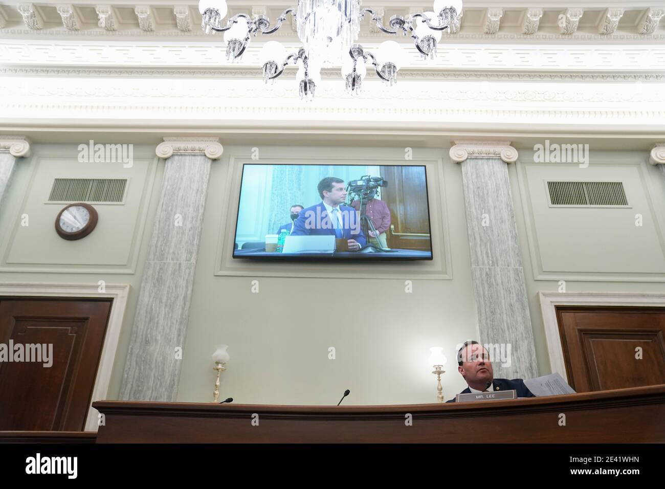 United States Senator Mike Lee (Republican of Utah), bottom right, speaks as Pete Buttigieg, U.S. secretary of transportation nominee for U.S. President Joe Biden, is displayed on a television monitor during a Senate Commerce, Science and Transportation Committee confirmation hearing in Washington, D.C., U.S., on Thursday, Jan. 21, 2021. Buttigieg, is pledging to carry out the administration's ambitious agenda to rebuild the nation's infrastructure, calling it a 'generational opportunity' to create new jobs, fight economic inequality and stem climate change. Credit: Stefani Reynolds / Pool via Stock Photo