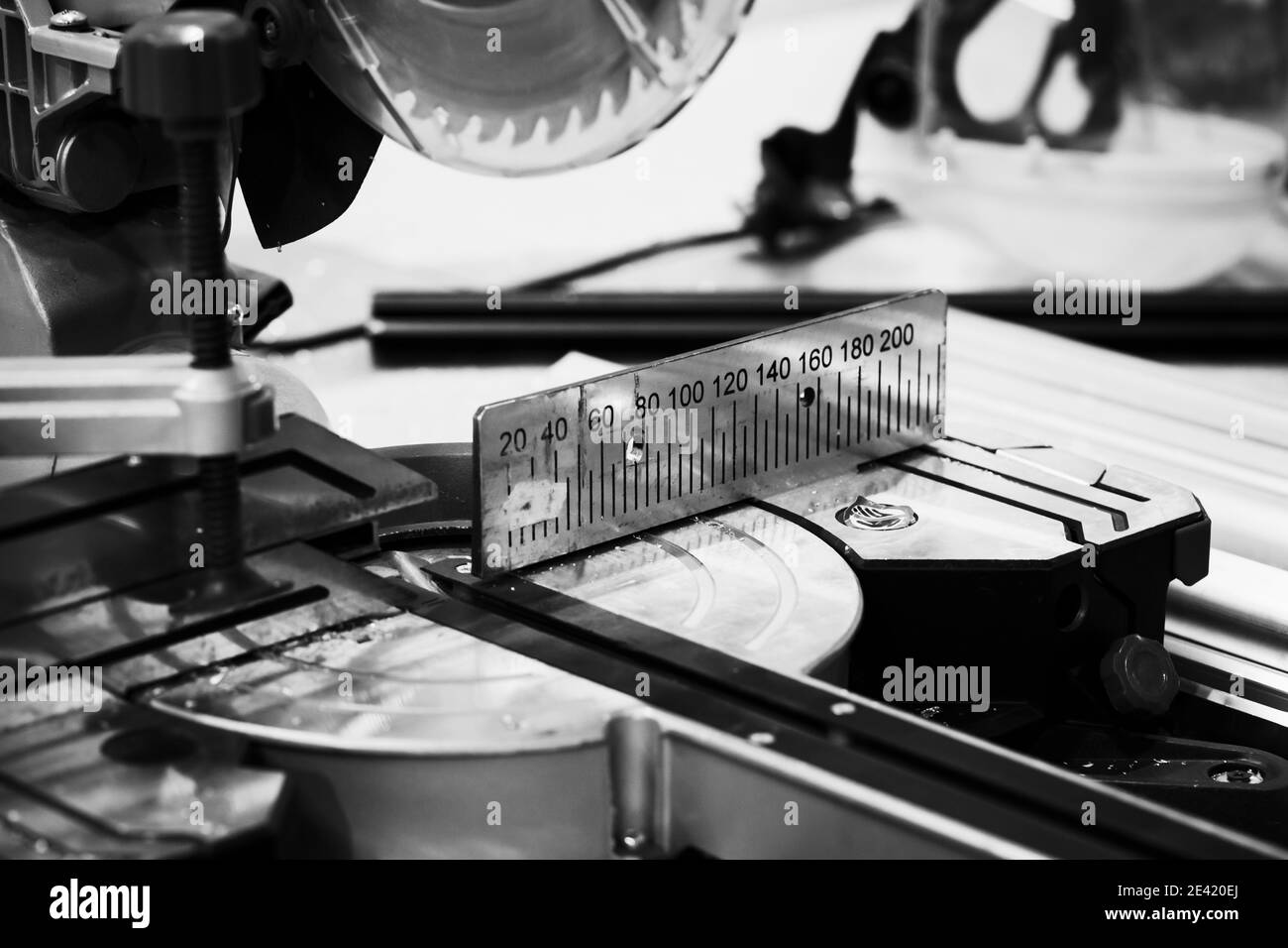Miter saw with ruler, close-up black and white photo with selective sort focus Stock Photo