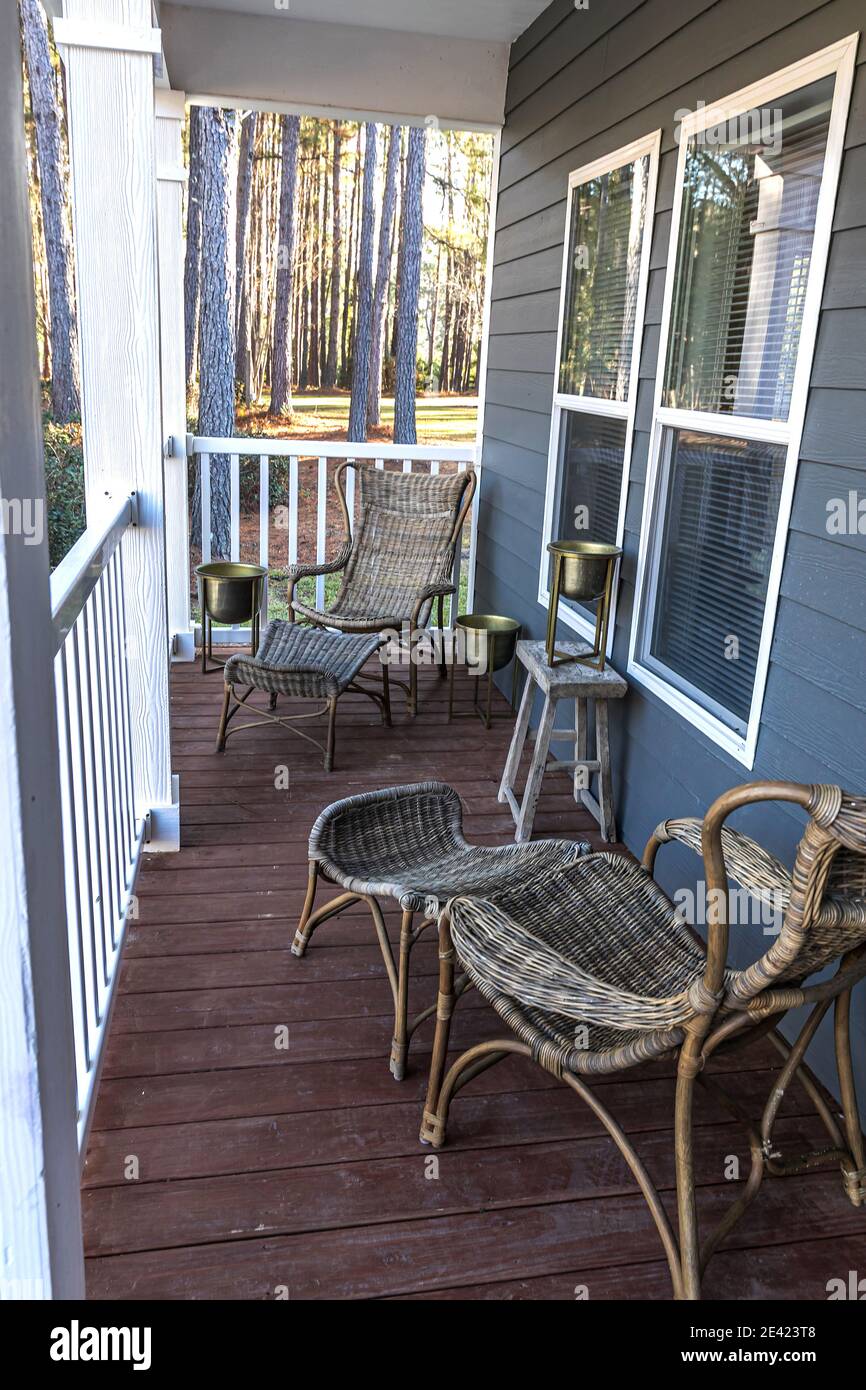 Small blue gray mobile home front porch with rattan chairs Stock ...