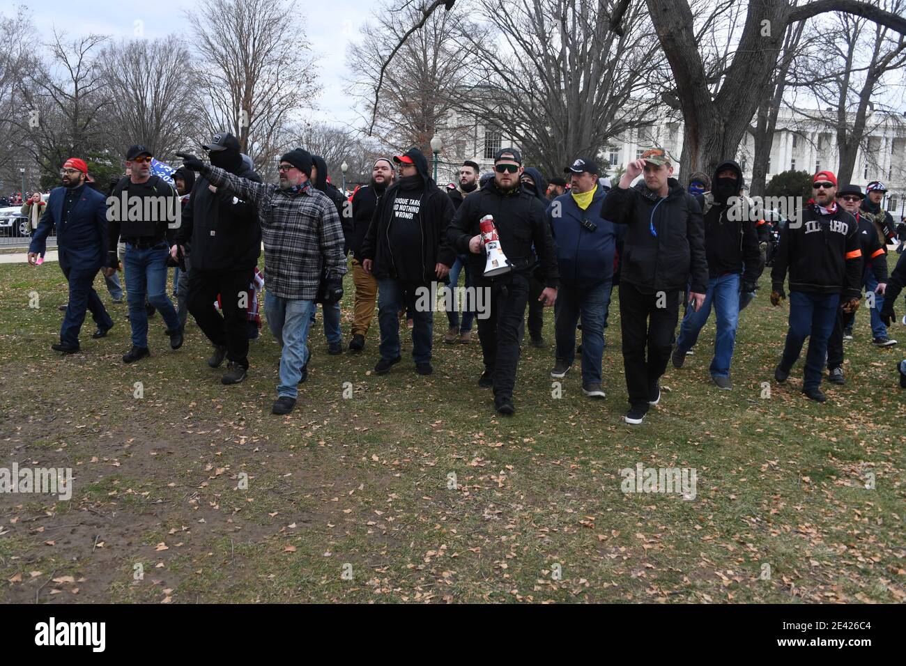 January 6, 2021, Washington, District of Columbia, USA: Proud Boys organizer JOSEPH RANDALL BIGGS, 37, (center pointing) walks with other protestors and President Trump supporters prior to storming the U.S. Capitol as the Congress is meeting in a joint session to count each state's electoral votes. The Capitol has been locked down and staffers were evacuated from two congressional buildings as crowds tried to breach them. Dozens of protesters, many wearing red hats and holding 'Trump' flags, could be seen walking through the Capitol's Statuary Hall. (Credit Image: © Christy Bowe/ZUMA Wire) Stock Photo