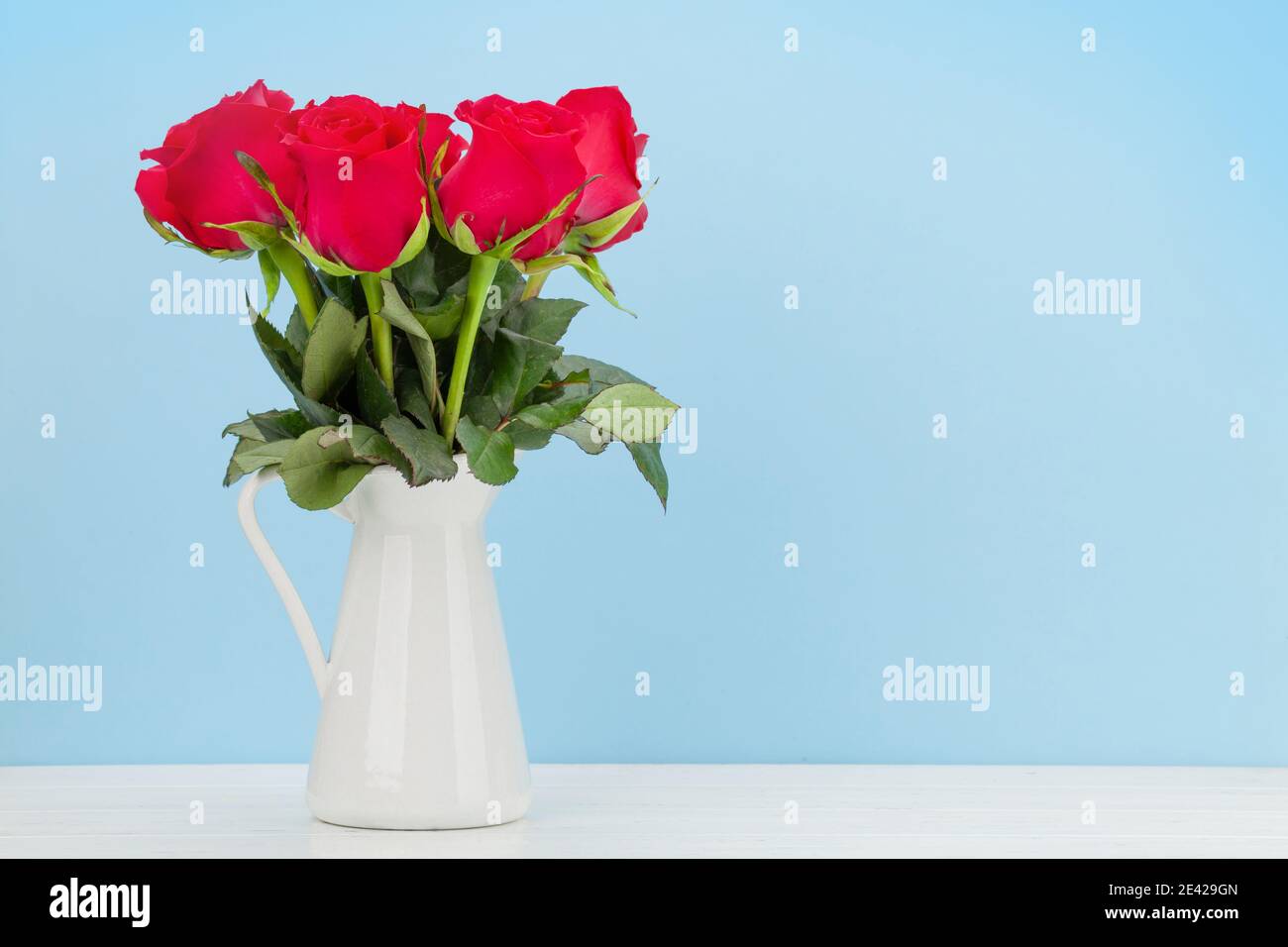 Valentines day greeting card with red rose flowers bouquet on wooden ...
