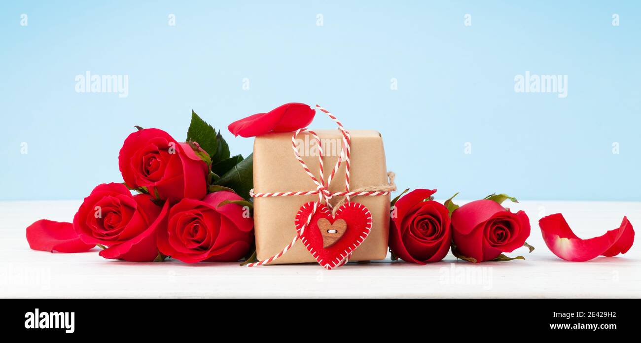 Valentines day greeting card with red rose flowers bouquet and gift box ...