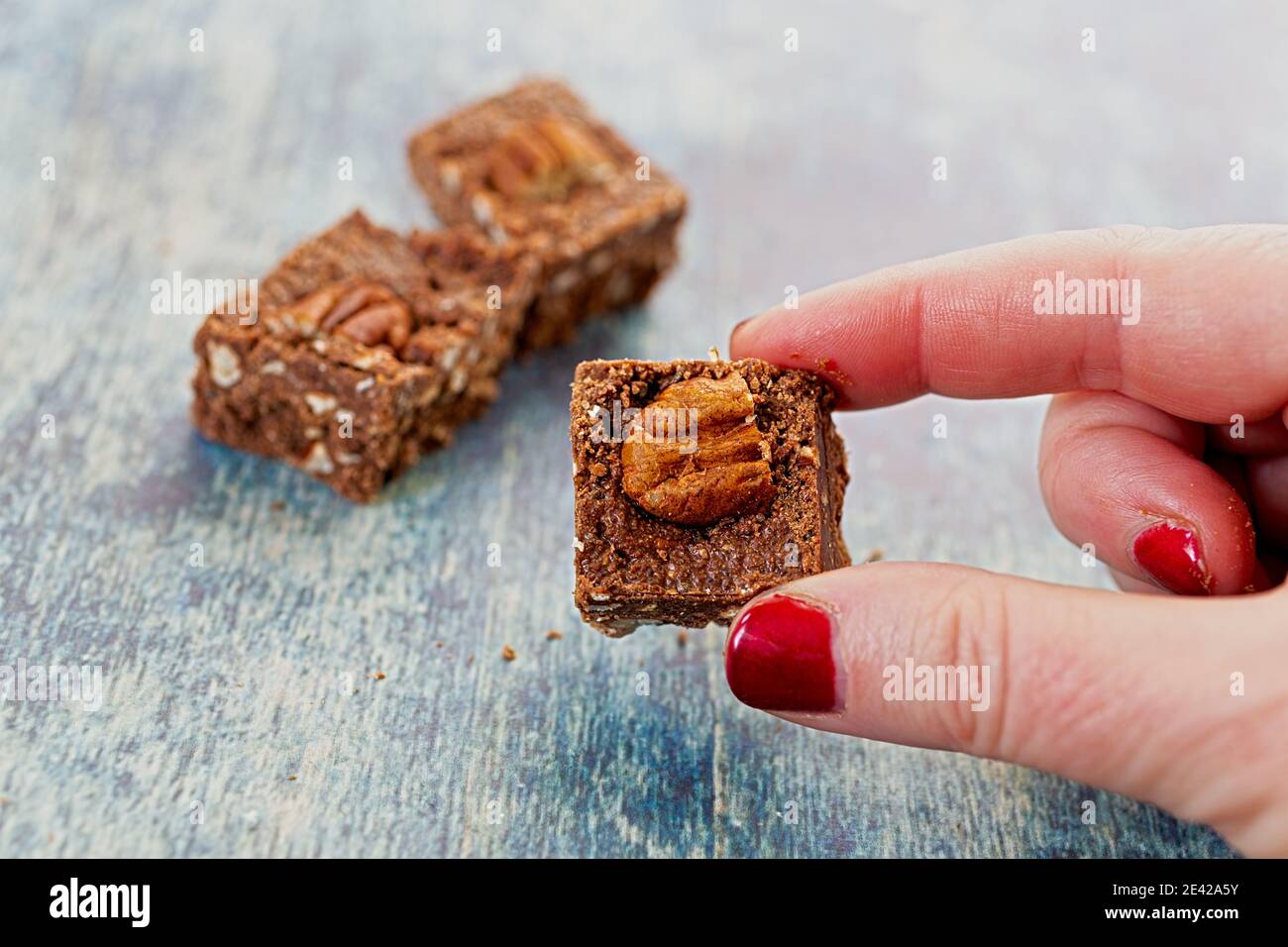 Healthy homemade keto chocolate brownies with lots of pecans. Stock Photo