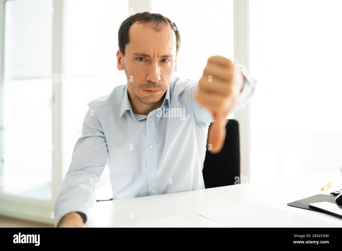 Man Portrait Showing Dislike Thumbs Down Negative Feedback Stock Photo