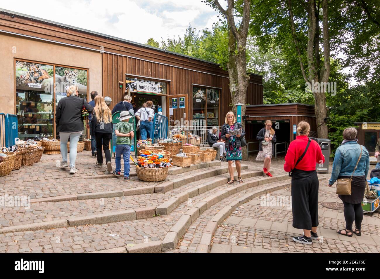 Aalborg, Denmark - 25 Jul 2020: Zoo shop in Aalborg zoo, People are standing on the stairs to the shop with souvenirs Stock Photo