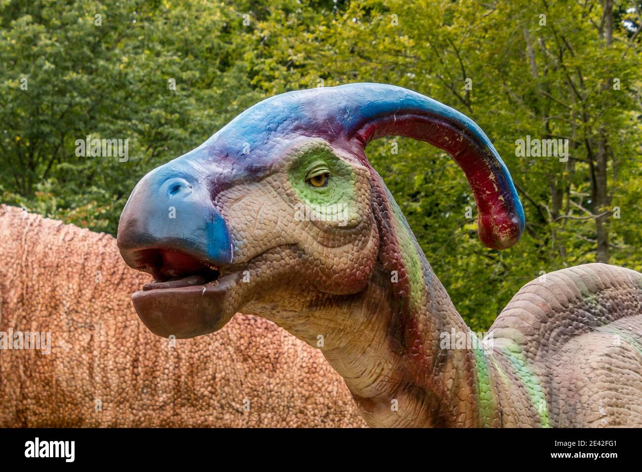 Aalborg, Denmark - 25 Jul 2020: Dinosaur in natural surroundings and in lifelike size, Stock Photo