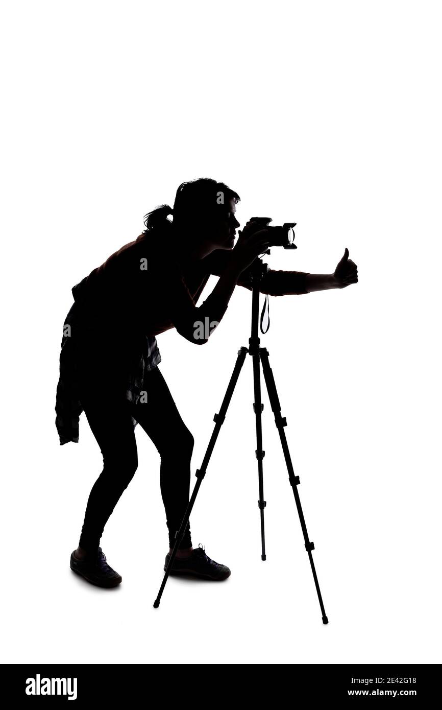 Silhouette of a photographer with a camera on a white background ...