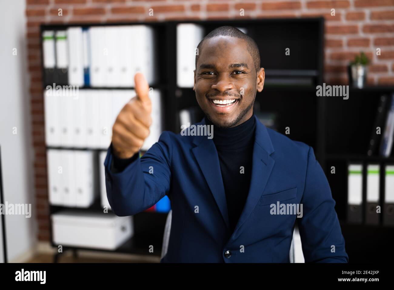 Happy black man thumbs up hi-res stock photography and images - Alamy