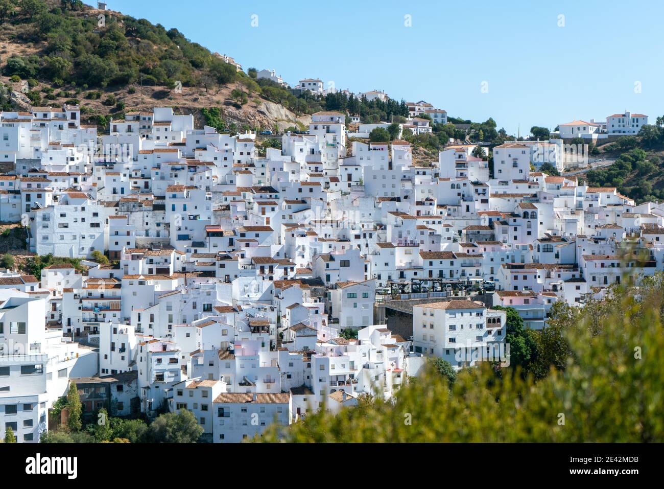Typical spanish mountain village with its narrow white buildings in