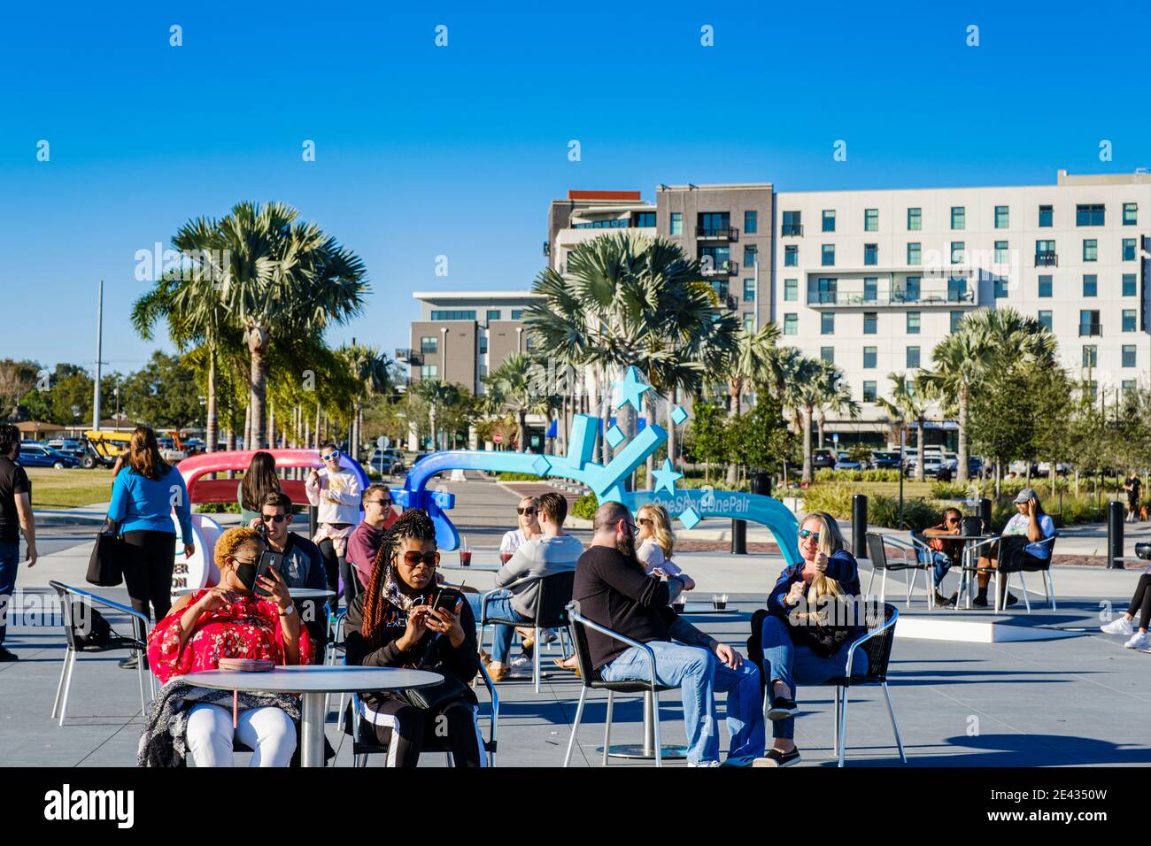 People engaging by the Tampa Riverwalk near Armature Works in Tampa Heights, Tampa, Florida. Tampa's first suburb established in 1883. The Tampa Heigh Stock Photo
