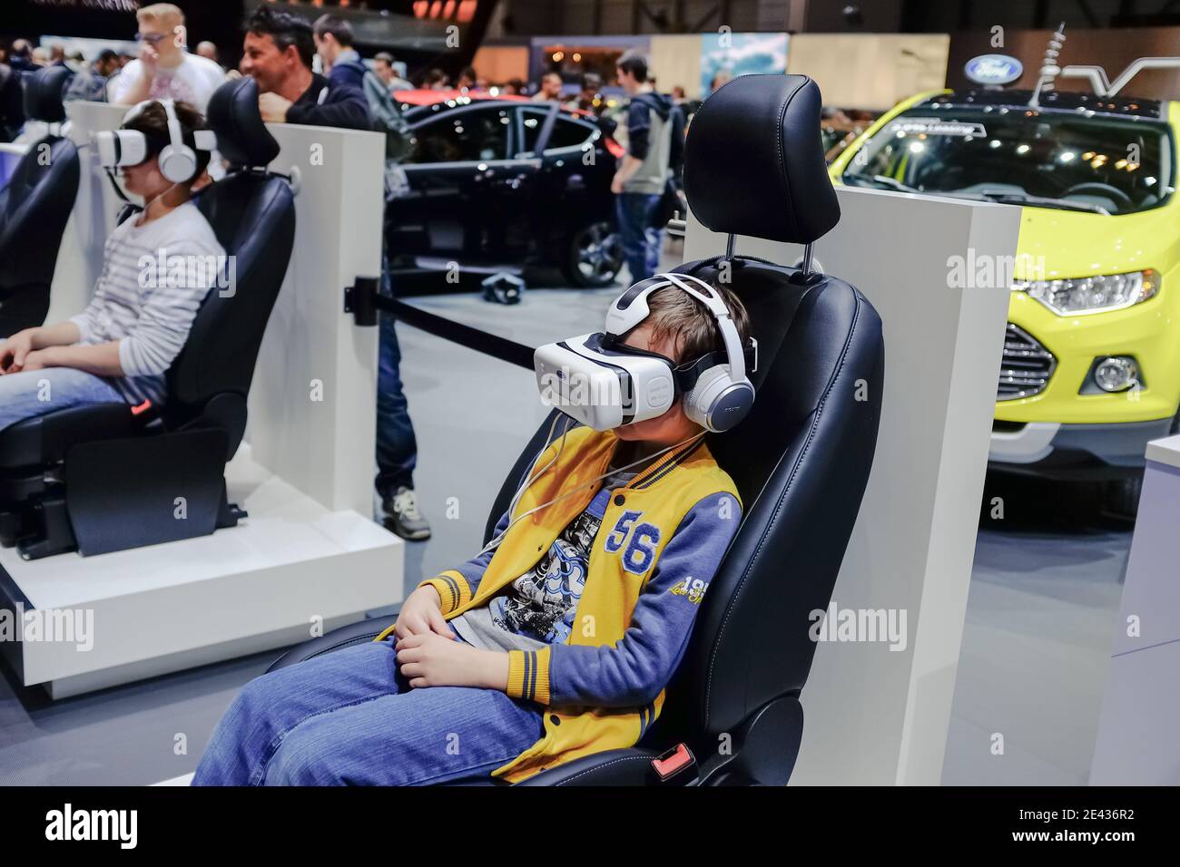 Young guy using vr headset for visual 3d experience in an tech exibition show. Stock Photo