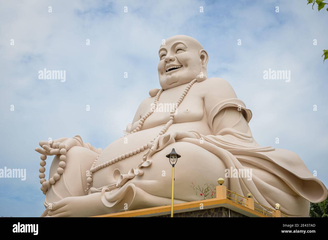 Happy Buddha statue at Vinh Trang Pagoda, Vietnam Stock Photo