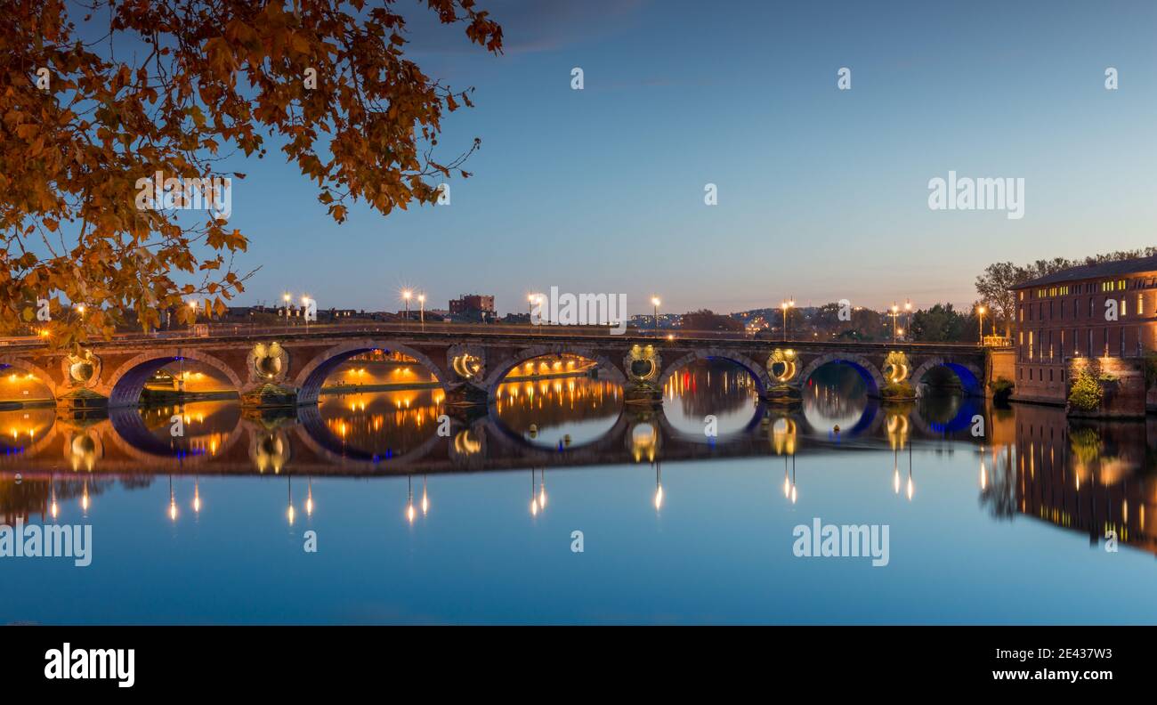 Magnificent Pont Neuf and its reflections on the Garonne river in the evening in Toulouse, Haute Garonne, Occitania, France Stock Photo