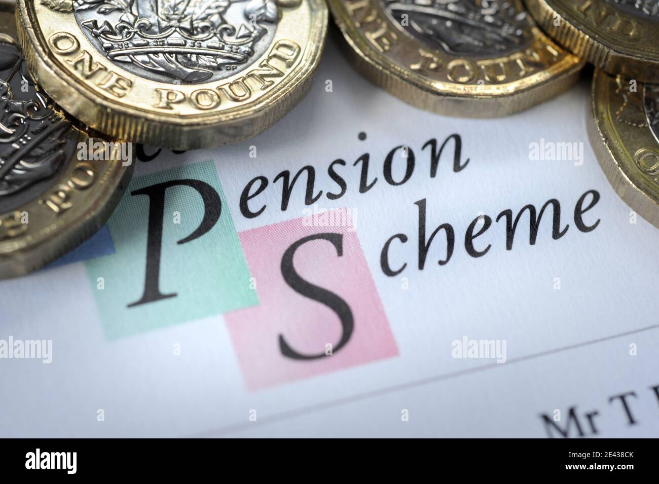 PENSION SCHEME LETTER WITH ONE POUND COINS RE PENSIONS PENSIONERS RETIREMENT SAVINGS ETC UK Stock Photo