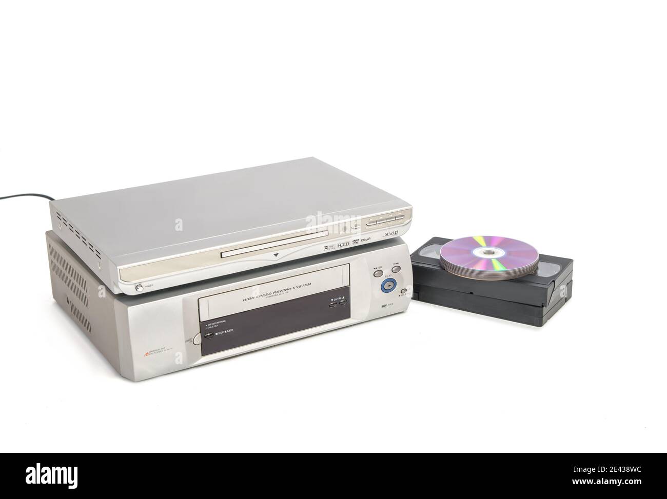 Dvd player over vhs player next to video tapes and cds isolated on white  background Stock Photo - Alamy