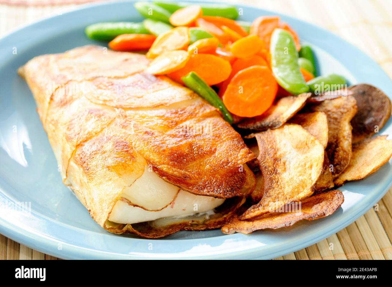 halibut fish fillets wrapped in potato Stock Photo Alamy