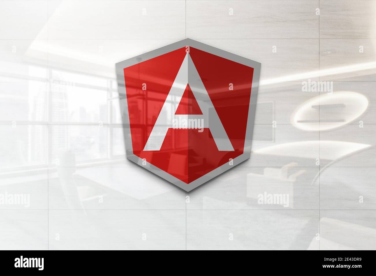 angular logo on reflective business wall plaque Stock Photo - Alamy