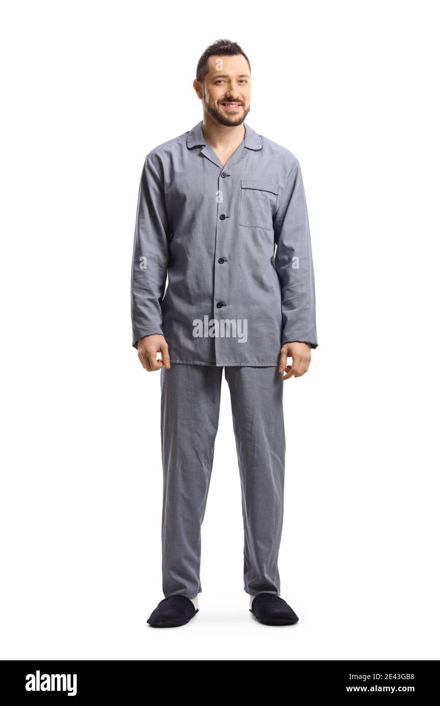 Full length portrait of a man in pajamas standing isolated on white ...