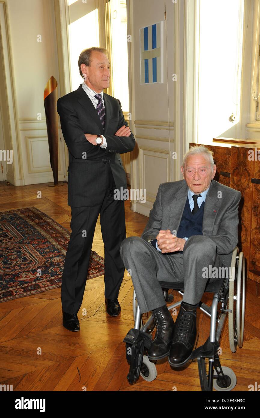 Robert Lamoureux and Paris Mayor Bertrand Delanoe posing at Paris City Hall in Paris, France on March 31, 2009. Robert Lamoureux received the medal of 'Medaille de La Ville de Paris' from Paris mayor Bertrand Delanoe at the Hotel de Ville in Paris, France on March 31, 2009. Photo by Thierry Orban/ABACAPRESS.COM Stock Photo