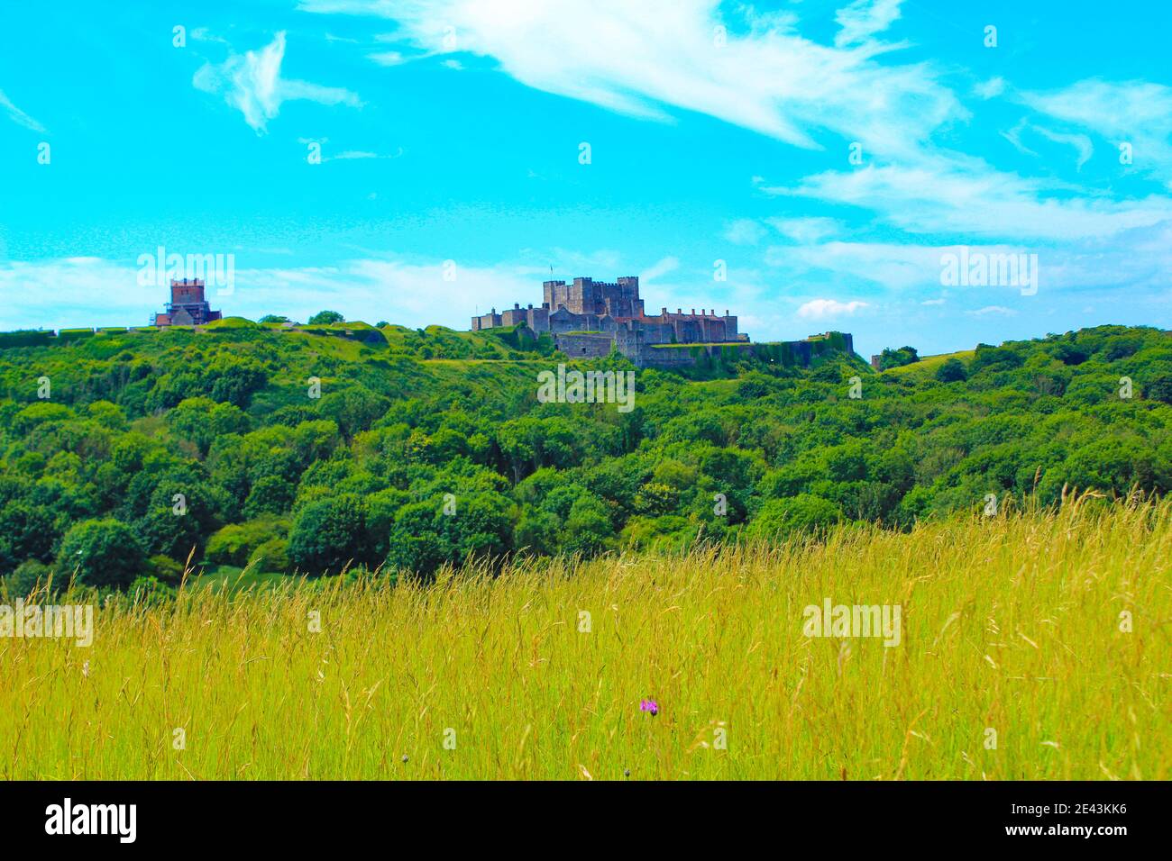 Dover Castle seen from the White Cliffs of Dover, is the region of English coastline facing the Strait of Dover and France.July 2016 Stock Photo