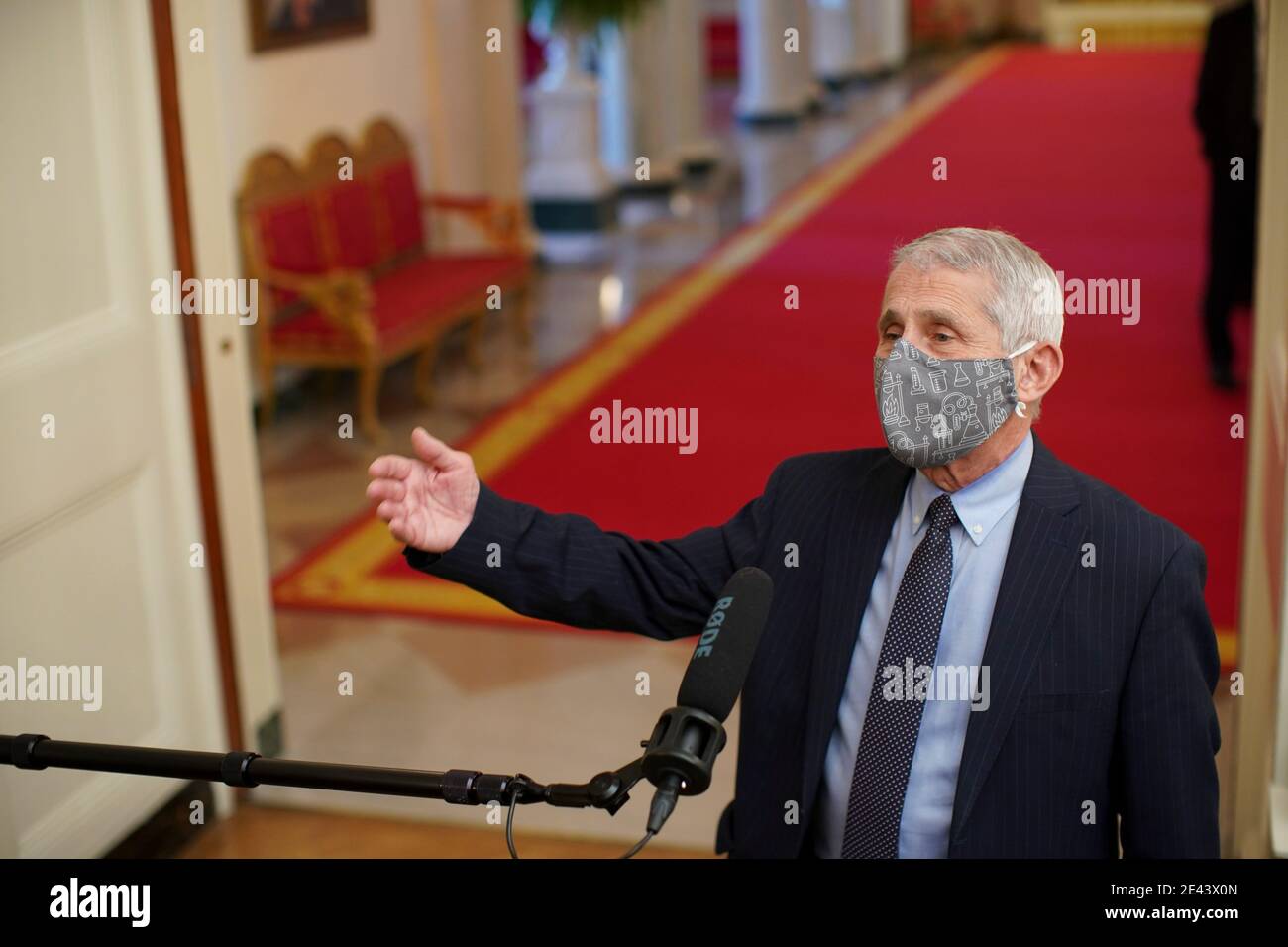 Anthony Fauci, director of the National Institute of Allergy and Infectious Diseases, speaks to members of the media before an event on the Biden administration's Covid-19 response in the State Dining Room of the White House in Washington, DC, U.S., on Thursday, Jan. 21, 2021. Biden in his first full day in office plans to issue a sweeping set of executive orders to tackle the raging Covid-19 pandemic that will rapidly reverse or refashion many of his predecessor's most heavily criticized policies. Credit: Al Drago/Pool via CNP | usage worldwide Stock Photo