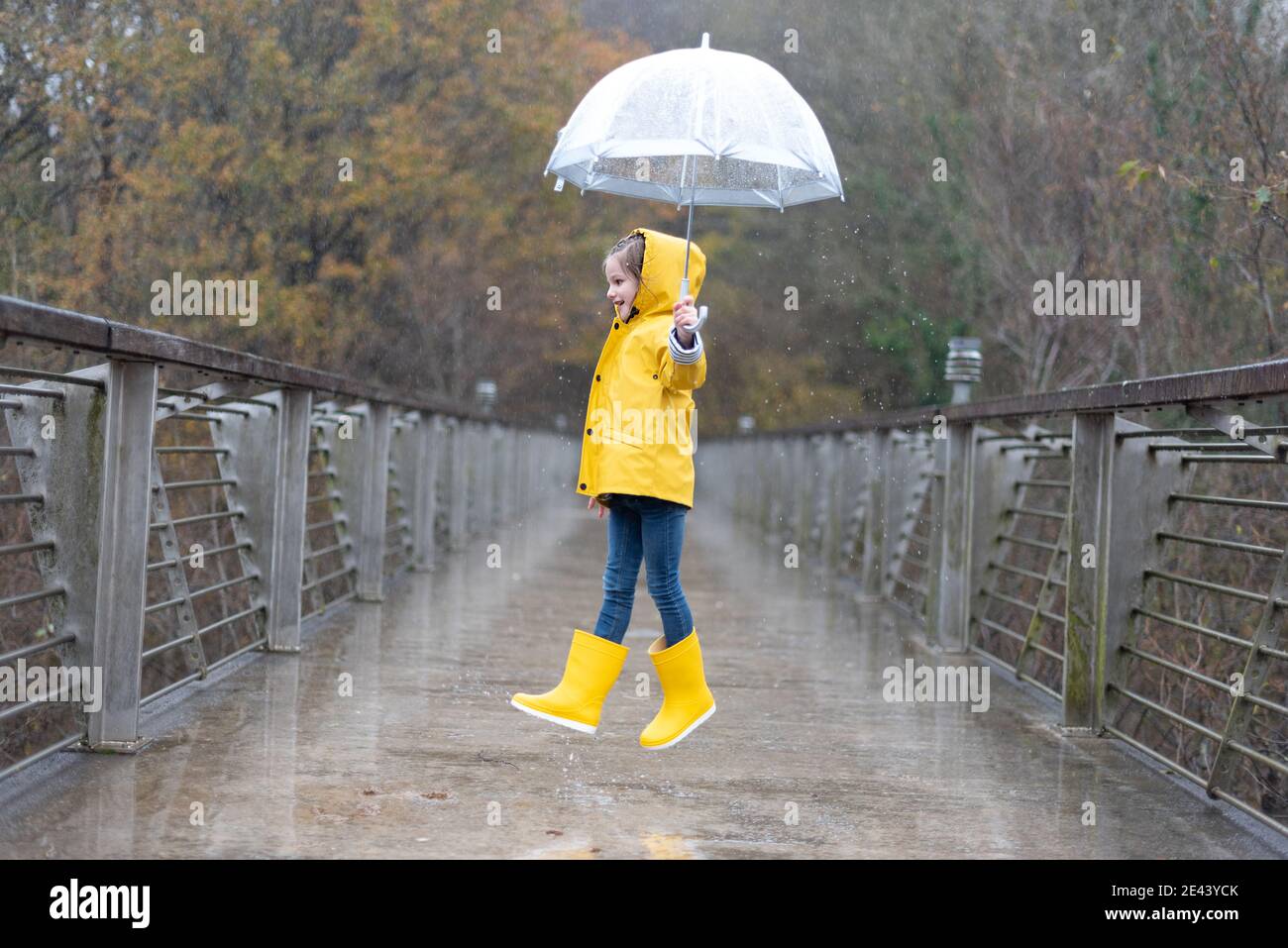 bright yellow raincoat and rubber boots 