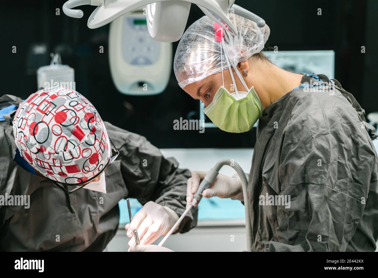 Professional dentist applying anesthetic injection to patient while