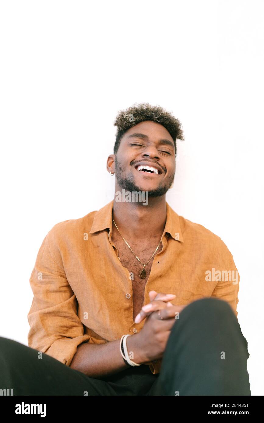 Cheerful man curly hair hi-res stock photography and images - Alamy