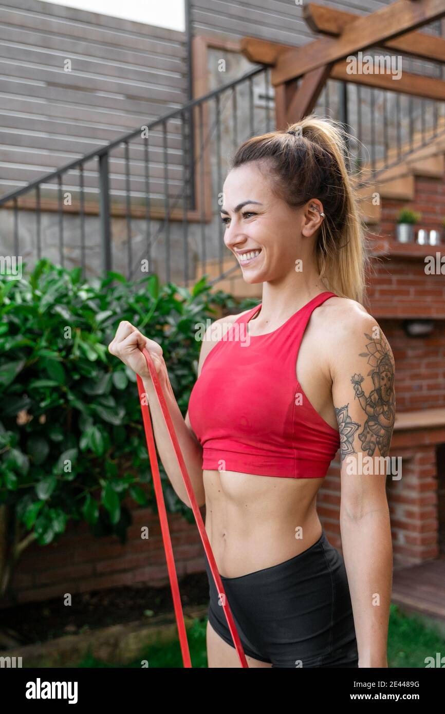 Bicep curl exercise resistance band hi res stock photography and images Alamy