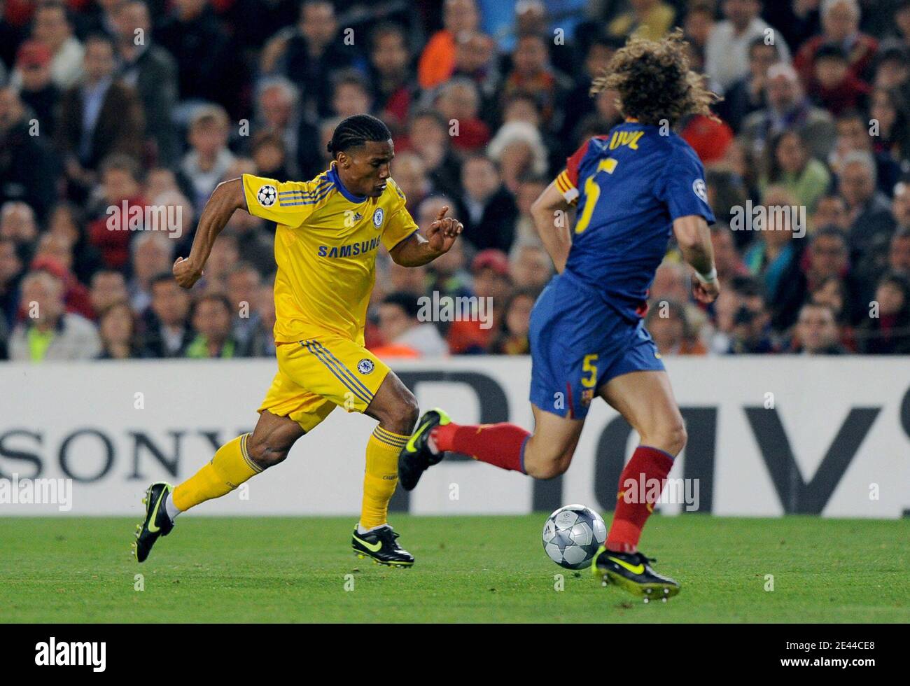 Chelsea's Florent Malouda and FC Barcelona's Carles Puyol during the UEFA Champions  League, Semi Final, First Leg, Barcelona vs Chelsea at the Nou Camp stadium  in Barcelona, Spain on April 28, 2009.