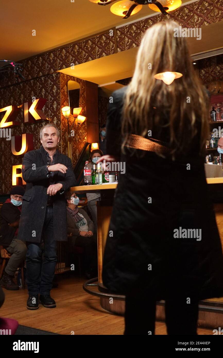 Berlin, Germany. 21st Jan, 2021. Lawyer Reiner Füllmich attends (l) a party  founding event at the "Scotch and Sofa" bar in Prenzlauer Berg. A week  after police were called in for breaking