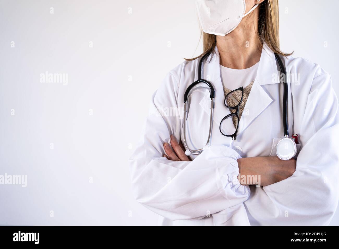 Cropped unrecognizable female doctor in white uniform and stethoscope ...