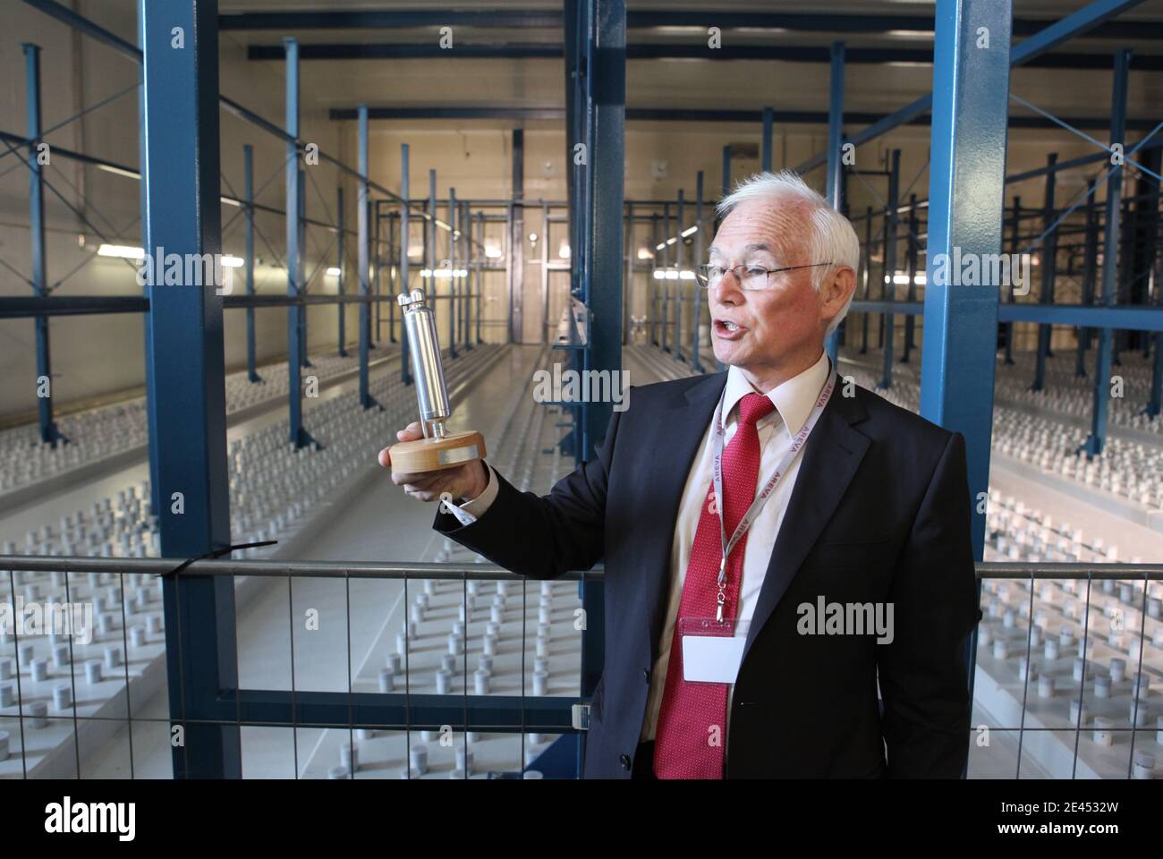 Gerard Perrat AREVA executive president presents a scale model the