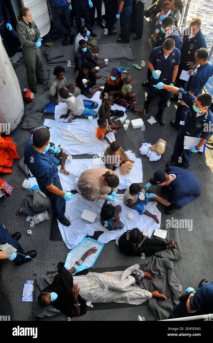 Somali migrants, including a nine-month pregnant female, are treated aboard the guided-missile cruiser USS Lake Champlain, after being rescued from a disabled skiff in the Gulf of Aden on May 24, 2009. The skiff, originally ferrying 52 passengers, was spotted in distress by Lake Champlain helicopter pilots while patrolling the area. Photo by Daniel Barker/USN via ABACAPRESS.COM Stock Photo