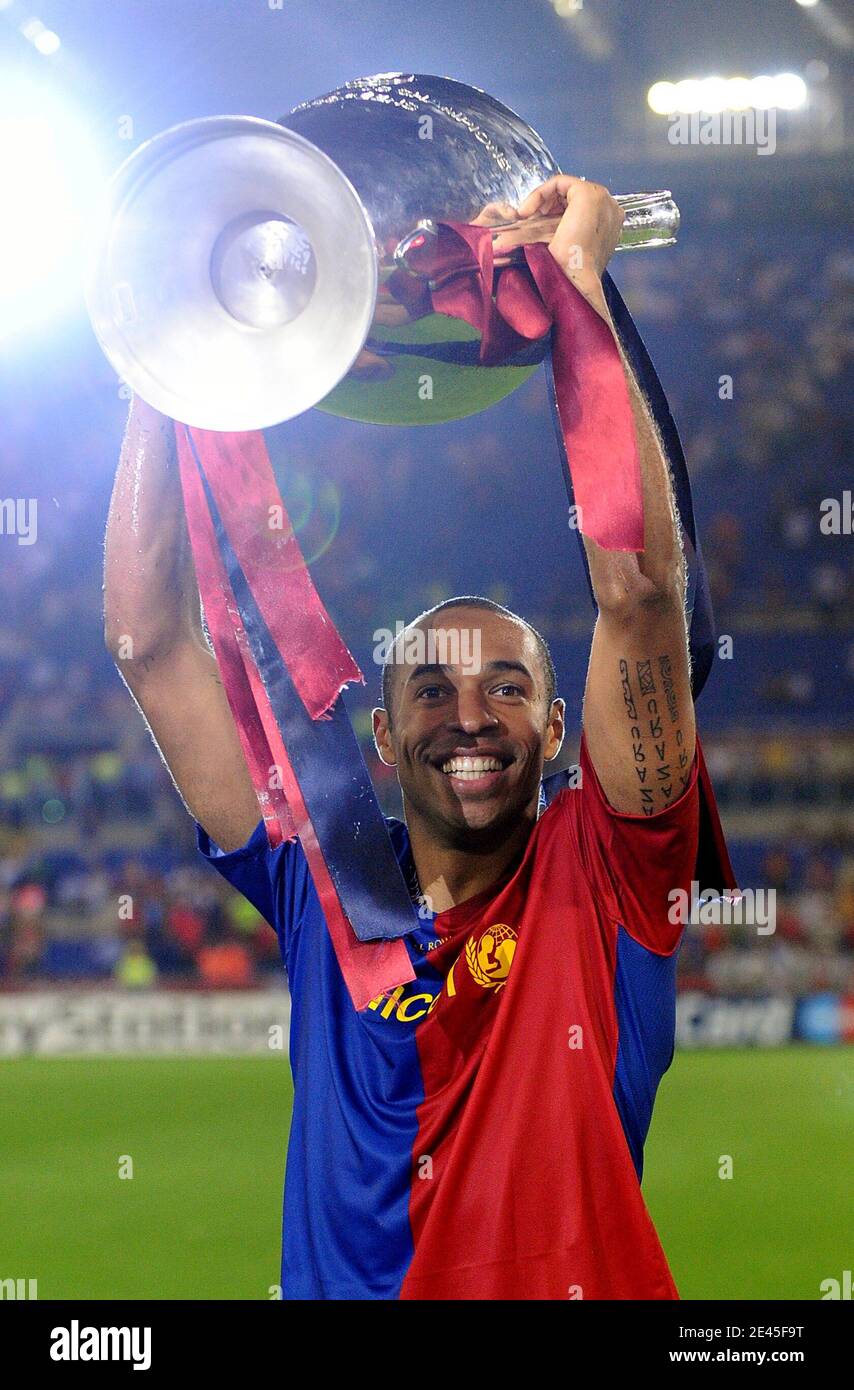 Barcelona's Thierry Henry celebrates with the UEFA Champions